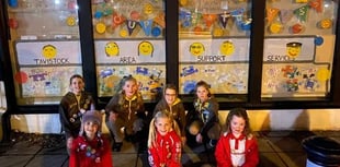 Brownies create window display for TASS