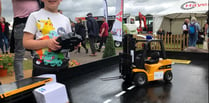 Mini forklifts on trade stand pull in young fans