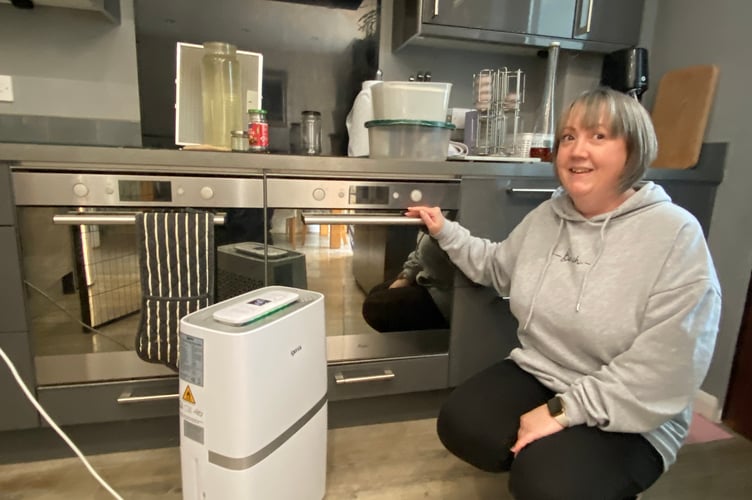 Tracey Lees drying out her flood damaged kitchen.water leak in Tavistock