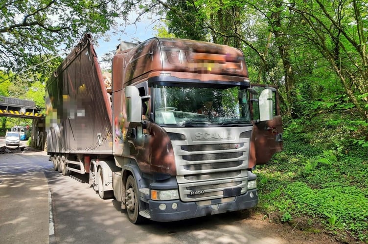 The lorry which struck the railway bridge.