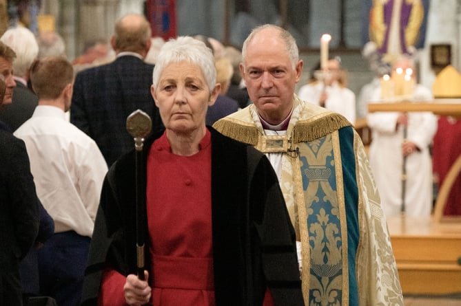 Bishop Robert being led down the nave at Exeter Cathedral.