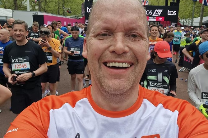 Paul McKenzie delighted at finishing the London Marathon in memory of his parents and in aid of Alzheimer's Research.