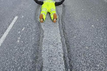 Tavistock's Mr Pothole lies down in crater