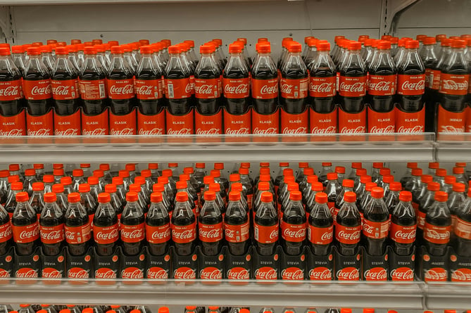 Coke bottles on a shelf