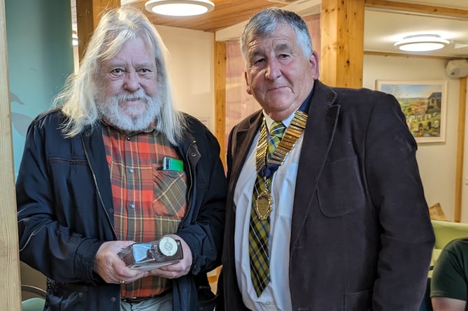Ian Beech is thanked for 12 years' service to Calstock Parish Council by parish council chairman Jim Wakem