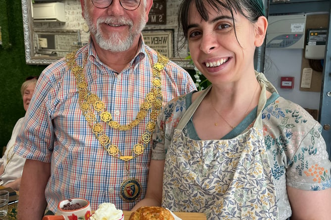 Ummihan Kuyturka, of Aroma Cafe shows Tavistock Mayor Paul Ward her Cream Tea Week Turkish-inspired dish with Feta dill scones served with whipped Labneh cheese with olives.