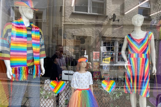 Woodside animal charity salutes Tavistock Pride with rainbow clothes in its shop window.