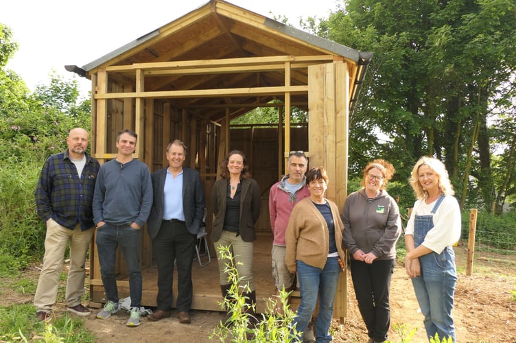 A photo of Cllrs Ursula Mann and Neil Jory with Milton Abbot Allotment Group members