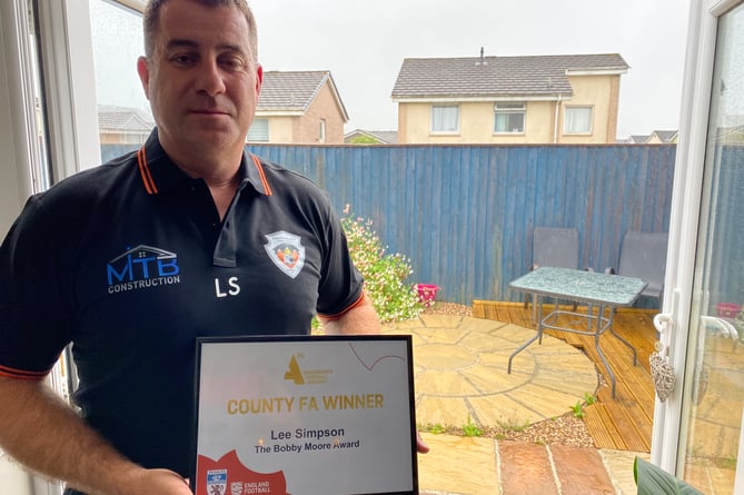 Lee Simpson receives a Devon FA award for his work with Horrabridge Rangers Sports Association