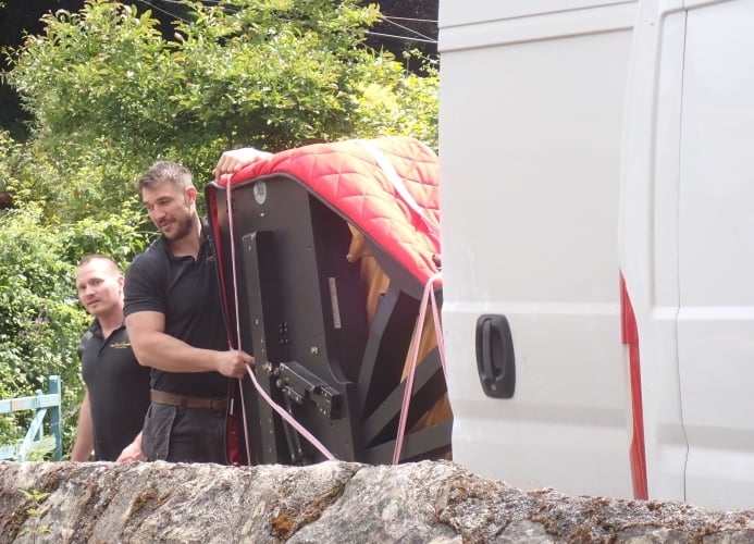 The piano being loaded into a van to be transported back to London after the festival.