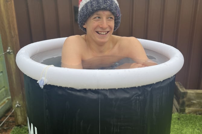 Matthew acclimatising to the cold water in an icy pod