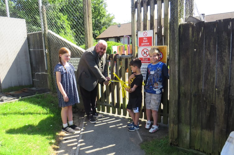 Portreeve Steve Pound and local children cut the ribbon on the revamped Rosemullion Gardens playpark. Picture: Submitted