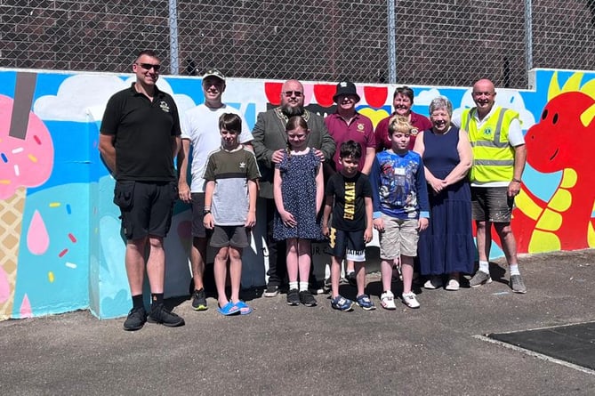 Artist Brad Waters, porteeve Steve Pound and guests at the official unveiling of the new mural. Picture: Submitted