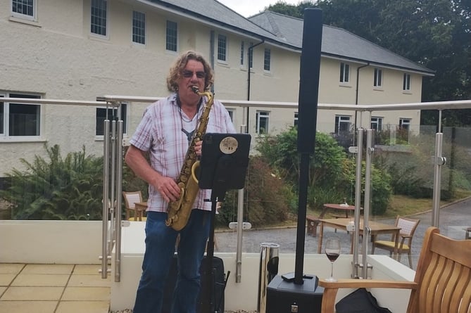 Saxophonist George Comer entertained guests at the barbecue