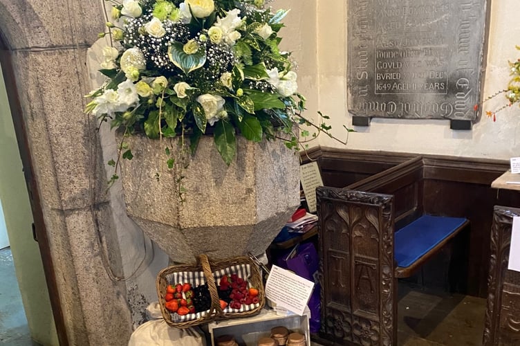 Lewtrenchard WI flower festival font display in tribute to the Rev Sabine Baring-Gould in St Peter's Church.