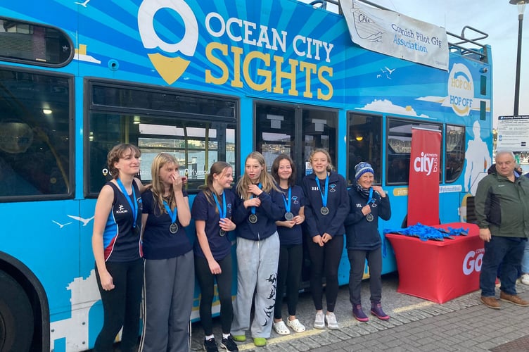 Plymouth CityBus was the headline sponsor of the event with the Ocean City Sights doubledecker the backdrop for the award presentations, here with the U14 girls team from Tamar and Tavy Gig Club. (Picture: Tamar and Tavy Gig Club).